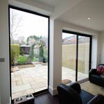 The picture window and sliding doors frame the garden and sky, providing tranquillity and relaxation